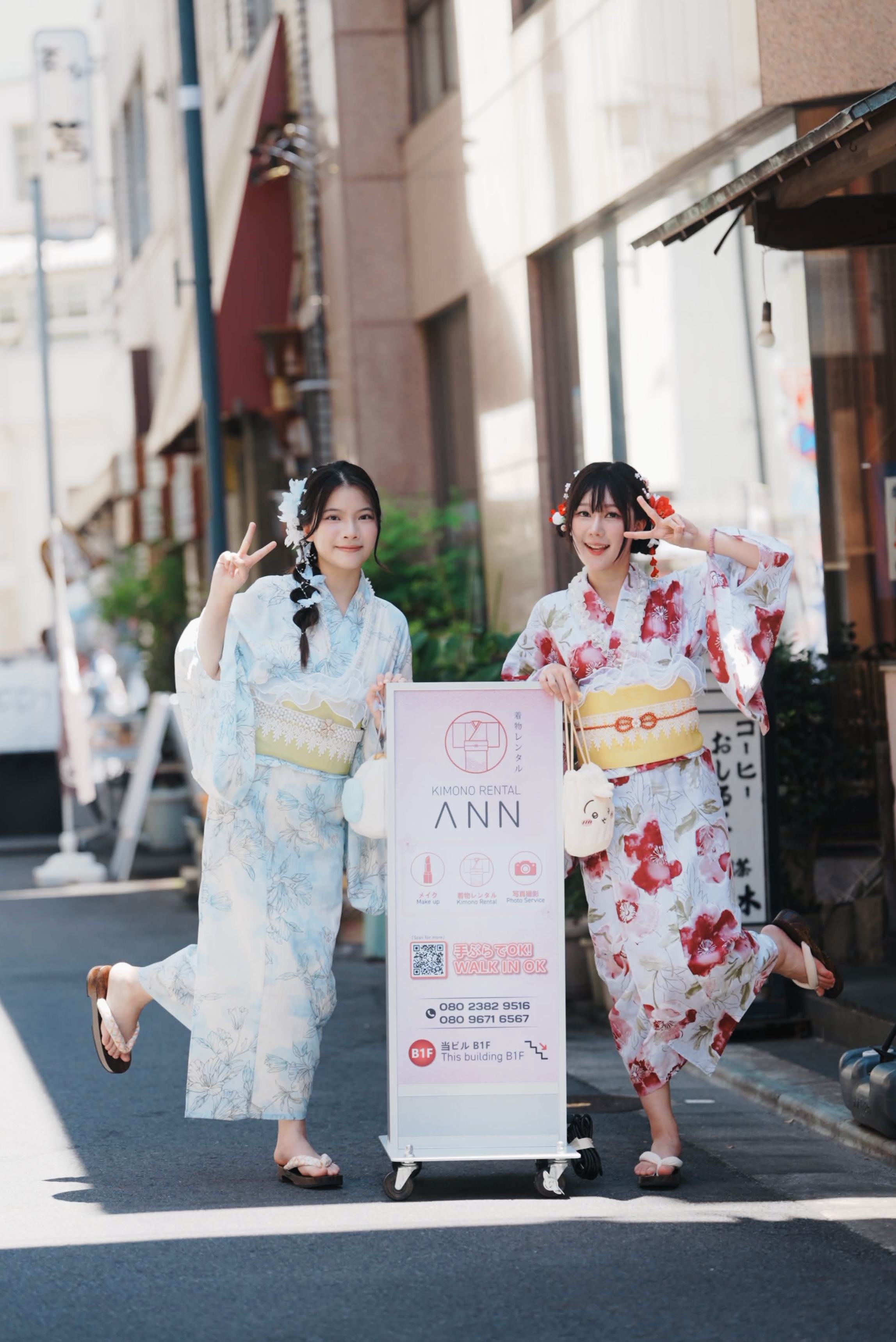 Guests posing at the LYAN storefront sign in Asakusa